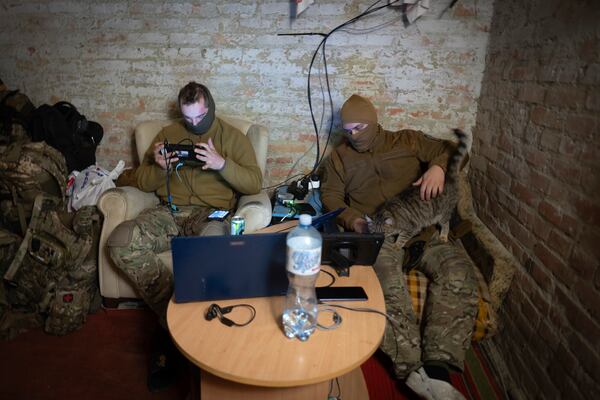 Servicemen of Ukraine's Khartia brigade pilot drones in a shelter on the frontline near Kharkiv, Ukraine, late Thursday, Nov. 7, 2024. (AP Photo/Efrem Lukatsky)