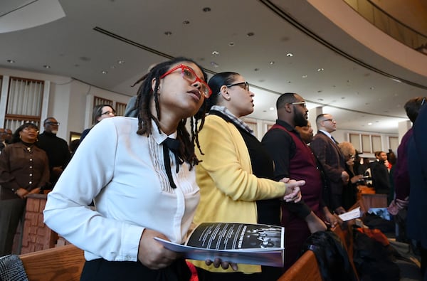 The audience reacts during the 57th Martin Luther King, Jr. Beloved Community Commemorative Service at Ebenezer Baptist Church, Monday, January 20, 2025, in Atlanta. (Hyosub Shin / AJC)