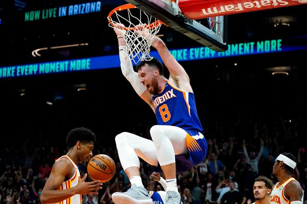 Phoenix Suns forward Frank Kaminsky (8) duns during the second half of an NBA basketball game against the Atlanta Hawks, Saturday, Nov. 6, 2021, in Phoenix. The Suns won 121-117. (AP Photo/Matt York)