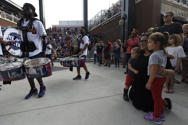 In this photo from the opening game at SunTrust Park, fans watch as the Atlanta Braves Heavy Hitters Drumline performs. Any Braves game has plenty of family fun, but the July 4th game against the Houston Astros also will include patriotic elements and fireworks. HENRY TAYLOR / HENRY.TAYLOR@AJC.COM