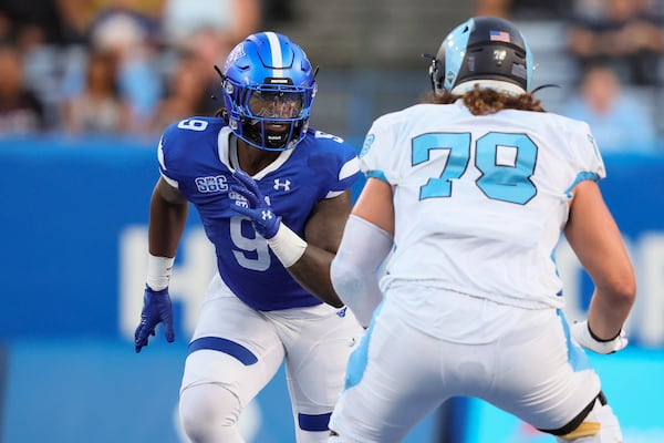 Georgia State linebacker Kevin Swint (9) goes against Rhode Island offensive lineman Lorenzo Thompson (78) during the first half at Center Parc Stadium, Thursday, August 31, 2023, in Atlanta. (Jason Getz / Jason.Getz@ajc.com)