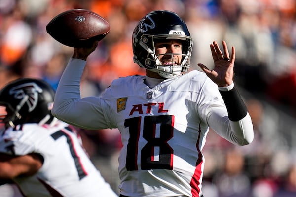 Atlanta Falcons quarterback Kirk Cousins (18) passes the ball against the Denver Broncos during the first half of an NFL football game, Sunday, Nov. 17, 2024, in Denver. (AP Photo/Jack Dempsey)