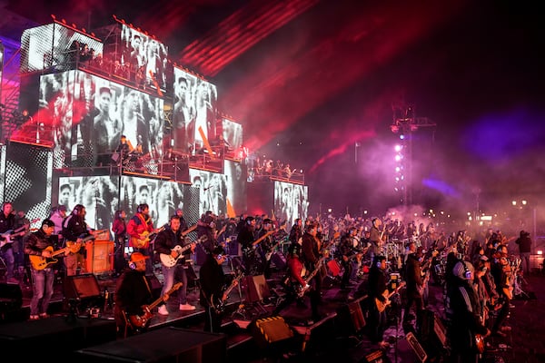 Musicians play on the stage during the concert for freedom for the 35th anniversary of the fall of the Berlin Wall, at the Brandenburg Gate in Berlin, Germany, Saturday, Nov. 9, 2024. (AP Photo/Ebrahim Noroozi)