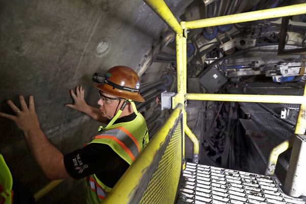 FILE - Mike Schmitt, project manager for the New York State Department of Environmental Protection, explains the design and construction of a 2.5-mile bypass tunnel for the Delaware Aqueduct in Marlboro, N.Y., May 16, 2018. (AP Photo/Julie Jacobson, File)