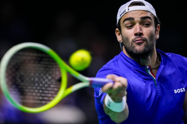 Italy's Matteo Berrettini returns the ball against Netherlands' Botic van de Zandschulp during the Davis Cup final tennis match between Netherlands and Italy at the Martin Carpena Sports Hall in Malaga, southern Spain, on Sunday, Nov. 24, 2024. (AP Photo/Manu Fernandez)