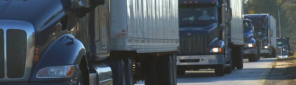 Trucks line up at a weigh station near Lithia Springs (NICK ARROYO/AJC)