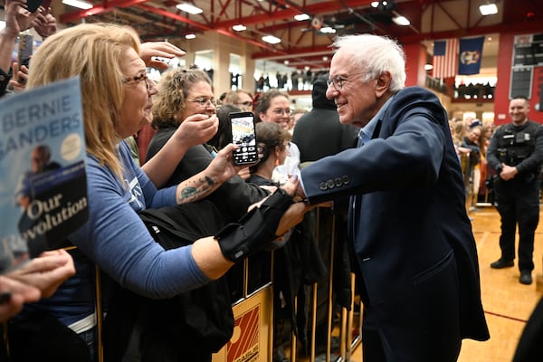 Sen. Bernie Sanders, I-Vt., right, greets the crowd following his speech on "Fighting Oligarchy: Where We Go From Here," Saturday, March 8, 2025 at Lincoln High School in Warren, Mich. (AP Photo/Jose Juarez)