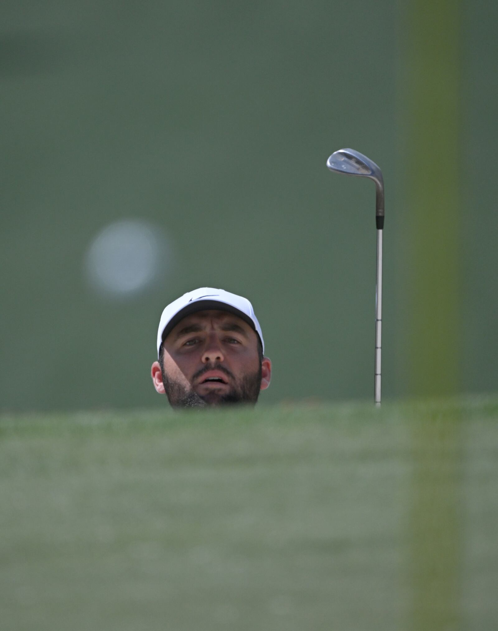 Scottie Scheffler watches his the flight of his ball ont he 7th green at the 2024 Masters Tournament at Augusta National Golf Club, Thursday, April 11, 2024, in Augusta, Ga. (Hyosub Shin / Hyosub.Shin@ajc.com)
