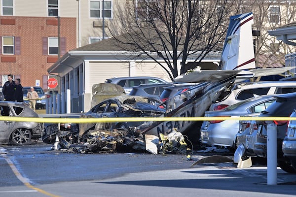 First responders work the scene after a plane crashed in the parking lot of a retirement community in Manheim Township, Pa., Sunday, March 9, 2025. (Suzette Wenger/LNP/LancasterOnline via AP)