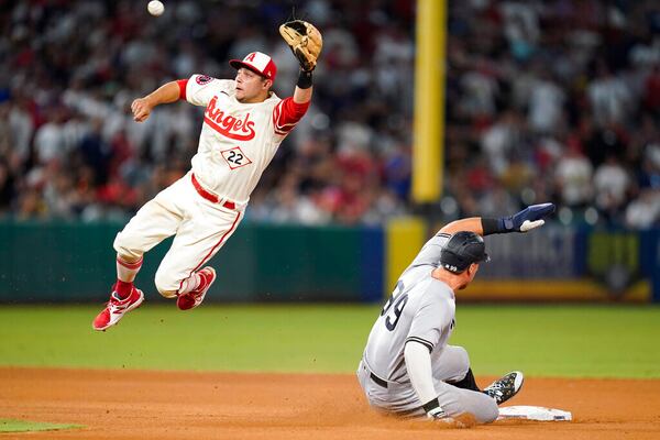 New York Yankees' Aaron Judge (99) steals second base ahead of a throw to Los Angeles Angels shortstop David Fletcher (22) during the ninth inning of a baseball game in Anaheim, Calif., Wednesday, Aug. 31, 2022. (AP Photo/Ashley Landis)