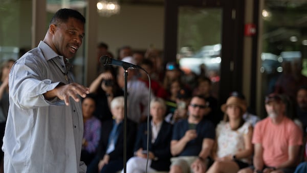 Republican Senate canididate Herschel Walker speaks to supporters during a campaign stop, Saturday, May 14, 2022, in Ellijay, Ga. (AP Photo/Mike Stewart, Pool)