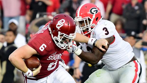 PASADENA, CA - JANUARY 01: Quarterback Baker Mayfield #6 of the Oklahoma Sooners looks to avoid a sack by linebacker Roquan Smith #3 of the Georgia Bulldogs in the second half in the 2018 College Football Playoff Semifinal at the Rose Bowl Game presented by Northwestern Mutual at the Rose Bowl on January 1, 2018 in Pasadena, California. (Photo by Harry How/Getty Images)