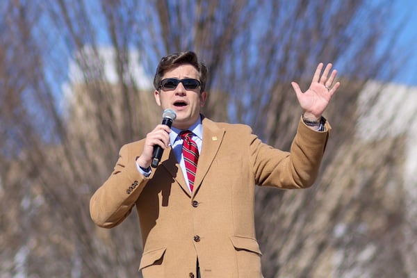 Nathaniel Darnell, the Georgia director for the National Federation of Republican Assemblies, speaks during the Georgia March for Life rally Friday at Liberty Plaza. During a prayer, Darnell referenced last year's death of  House Speaker David Ralston as a warning to other lawmakers who might not vote for tougher restrictions on abortion. Jason Getz / Jason.Getz@ajc.com)
