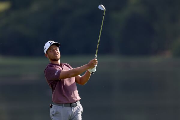 Xander Schauffele hits his second shot on the eighth fairway during the third round of the Tour Championship at East Lake Golf Club, Saturday, August 27, 2022, in Atlanta. (Jason Getz / Jason.Getz@ajc.com)