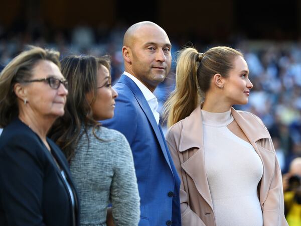 Derek Jeter looks on with wife Hannah Davis and the rest of his family during the retirement ceremony of his number 2 jersey at Yankee Stadium Sunday.