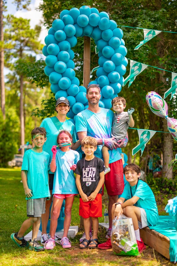 Kim Airhart smiles with her husband Chris and their five children (from left to right) Carter, Kate, Harrison, Holden, and Hayes. Photo provided by Kim Airhart