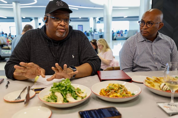 National Southern chef Duane Nutter (left), who seats beside Reggie Washington as they speak to AJC  Editor Kelly Yamanouchi about the food items they provided for Vino Volo at the new location in Terminal T at Hartsfield-Jackson Atlanta International Airport on Wednesday, May 1, 2024.
(Miguel Martinez / AJC)