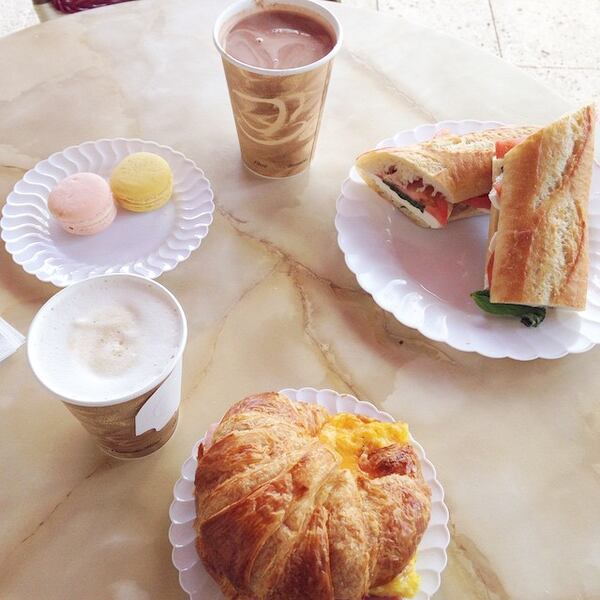 Breakfast croissant and Caprese panini, with macaroons (Samantha Ragland/The Palm Beach Post)