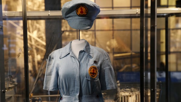 A female ordinance plant worker's uniform is part of the permanent exhibit "Salute to the Home Front" at the National World War II Museum which will open to the public this Saturday, in New Orleans, Monday, June 5, 2017. The exhibit tells the home front story from the 1920s to the development of the atomic bomb. (AP Photo/Gerald Herbert)