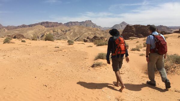 Two hikers enter the hottest section of desert on the Jordan Trail, between Petra and Wadi Rum. (Andrew Evans/Chicago Tribune/TNS)