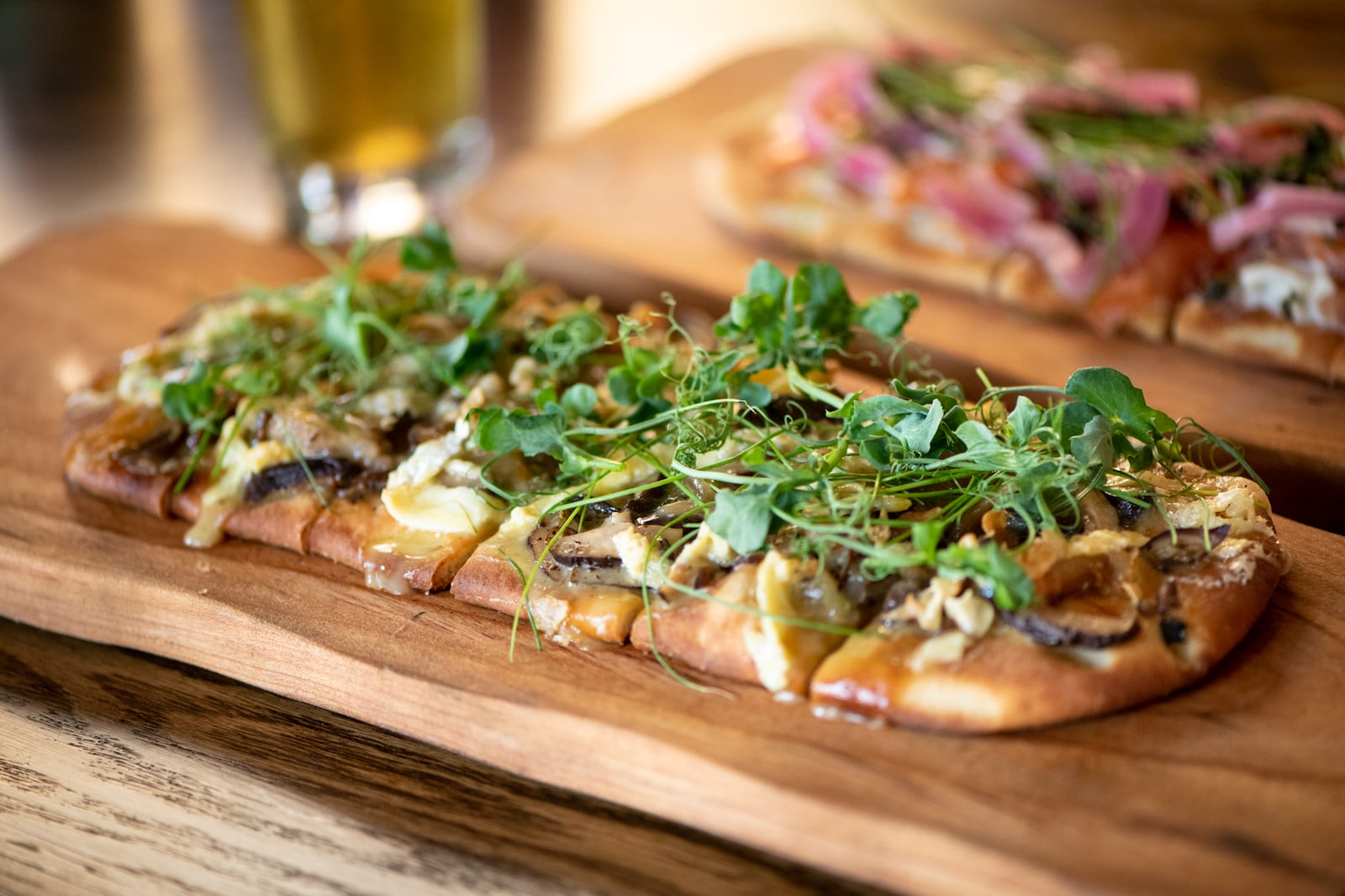 Bar (n) Booze (n) Bites Marinated Local Mushroom Flat Bread with caramelized onion, Green Hill cheese, and garlic chips.  (Mia Yakel for The Atlanta Journal-Constitution)