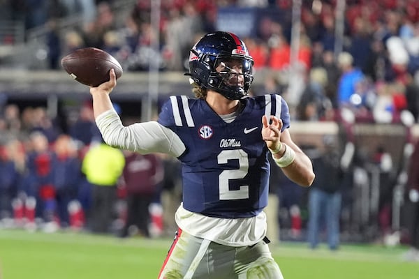 Mississippi quarterback Jaxson Dart looks to pass the ball against Mississippi State during the second half of an NCAA college football game, Friday, Nov. 29, 2024, in Oxford, Miss. (AP Photo/Rogelio V. Solis)