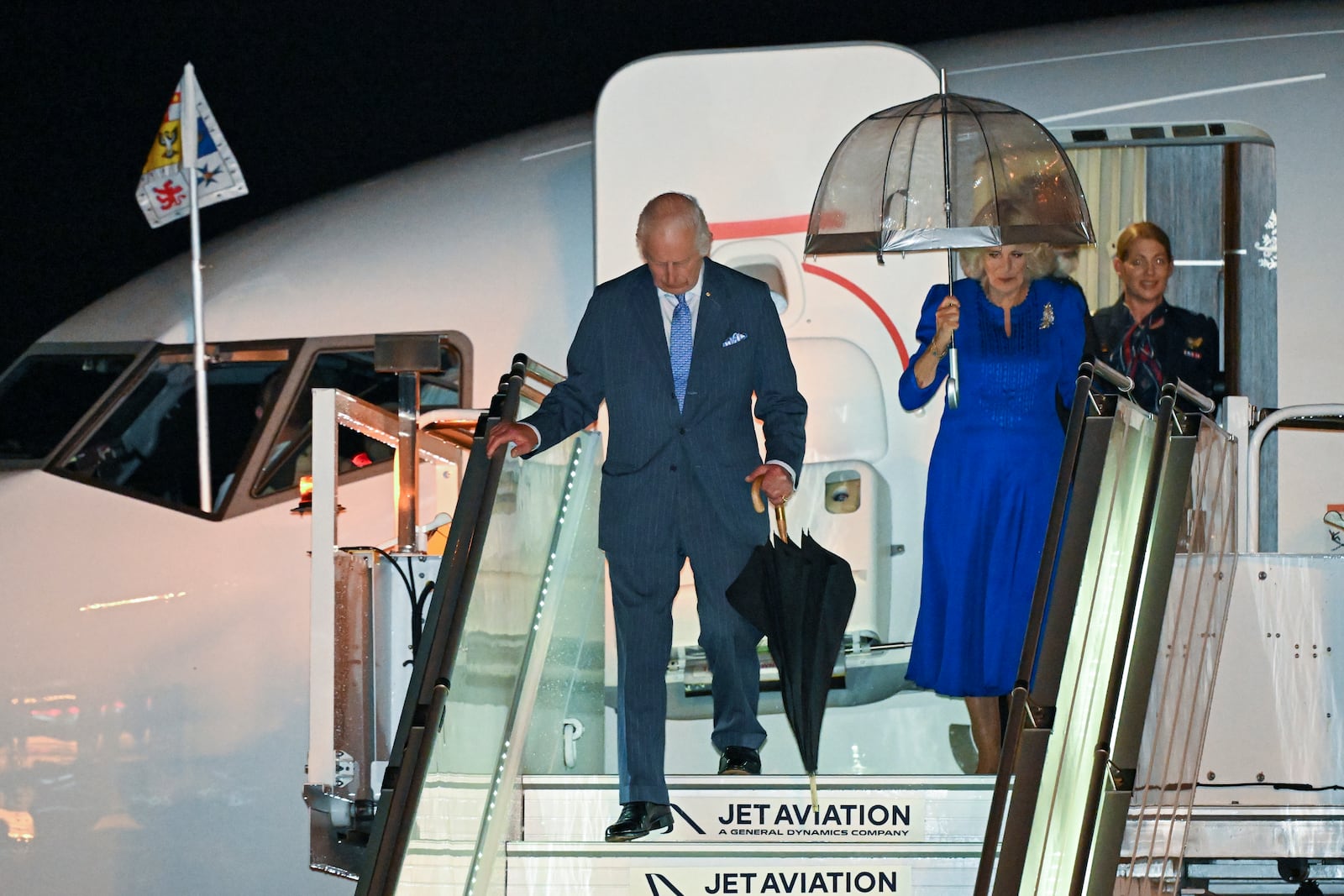 Britain's King Charles and Queen Camilla arrive in Sydney for the start of a five-day tour to Australia, Friday, Oct. 18, 2024. (Dean Lewins/AAP Image via AP)