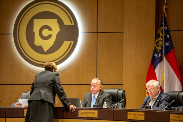 Superintendent Chris Ragsdale and school board member Randy Scamihorn (right) before the public portion of the Cobb County School Board monthly meeting Thursday, June 9, 2022. (Jenni Girtman for The Atlanta Journal-Constitution)