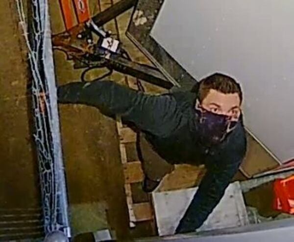 The man was captured on surveillance video breaking into the business.