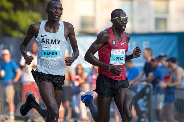 07/04/2018 -- Atlanta, GA -Front runners in the men's elite group push themselves during the 49th running of the AJC Peachtree road race near Piedmont Park, Wednesday, July 4, 2018.  ALYSSA POINTER/ALYSSA.POINTER@AJC.COM