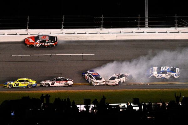 Denny Hamlin (11) and Cody Ware (51) collide between Turns 3 and 4 on the final lap during the NASCAR Daytona 500 auto race at Daytona International Speedway, Sunday, Feb. 16, 2025, in Daytona Beach, Fla. (AP Photo/Phelan M. Ebenhack)