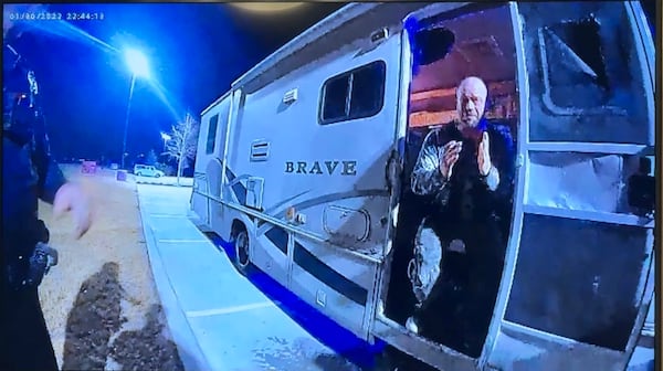 Warner Robins police body-camera footage played in court shows Christopher Scott Palmer greeting officers at the motor home where 9-month-old Cody Palmer was found dying the night of Jan. 30, 2022, outside a Buc-ee's along I-75 in Peach County. (Joe Kovac Jr. / AJC)