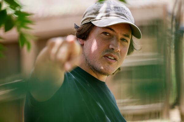 Jeff Kahn, a resident of Atwater in Sandy Springs, points to I-285/Ga. 400 construction across from his back yard on Friday, June 3, 2022. (Natrice Miller / natrice.miller@ajc.com)

