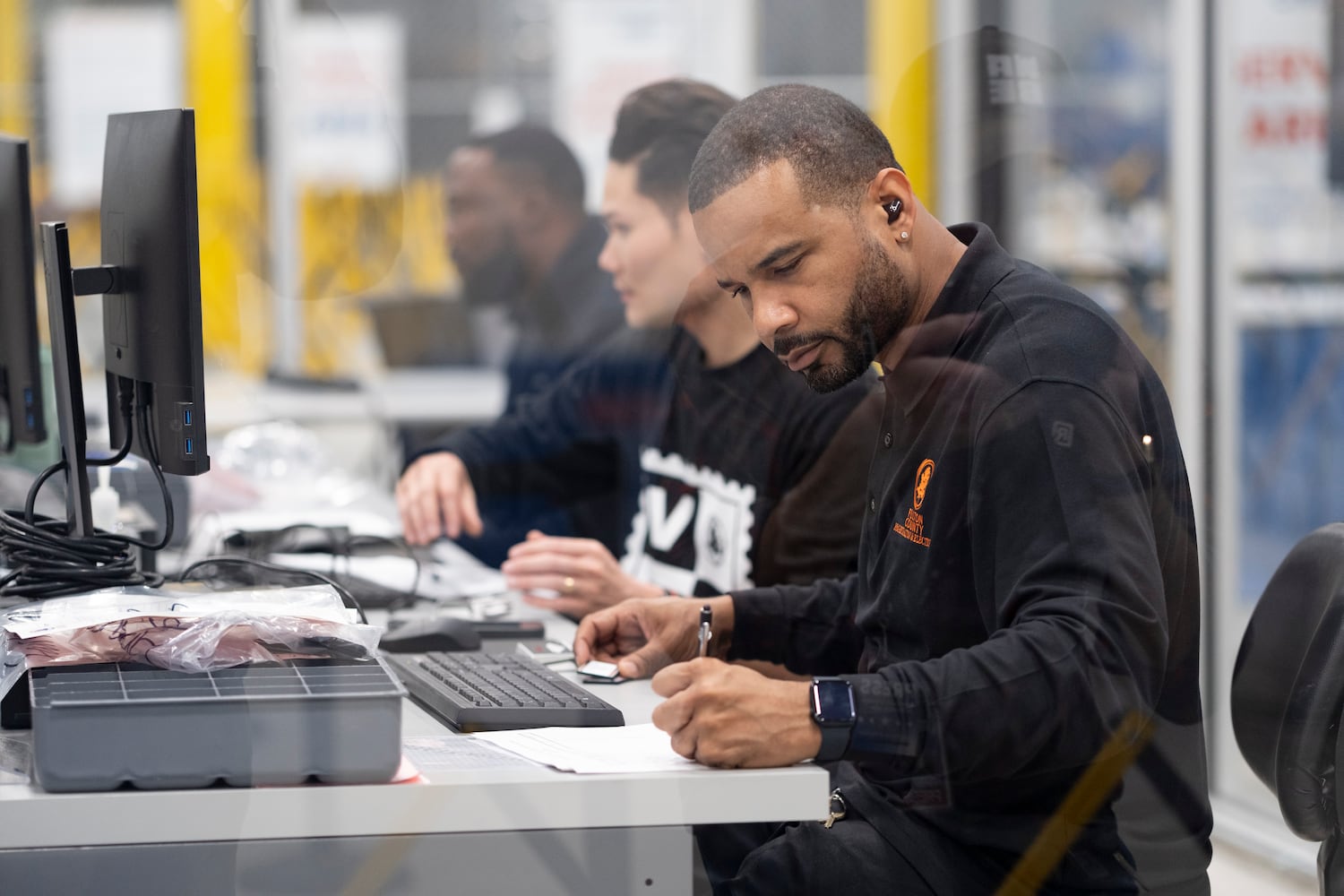 A worker uploads advance voting results at the Fulton County election hub in Fairburn on Tuesday, Nov. 5, 2024.   Ben Gray for the Atlanta Journal-Constitution