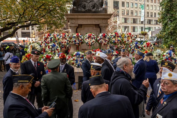 Veterans gather after a wreath laying service before the annual Veterans Day Parade, Monday, Nov. 11, 2024, in New York. (AP Photo/Adam Gray)