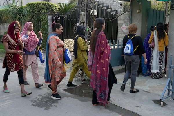 Transgender persons arrive to attend their cooking class at the Culinary & Hotel Institute of Pakistan, in Lahore, Pakistan, Tuesday, Feb. 25, 2025. (AP Photo/K.M Chaudary)