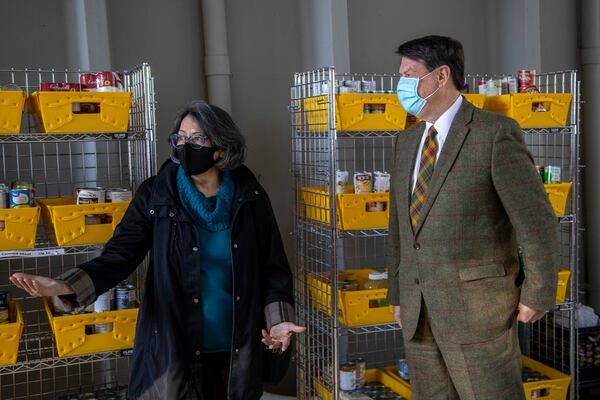 Tamara Carrera (left), longtime CEO of the Community Assistance Center speaks with Sandy Springs Mayor Rusty Paul (right) as she updates him on the progress of the center in Sandy Springs. The city has provided grants to CAC during the pandemic.  (Alyssa Pointer / Alyssa.Pointer@ajc.com)