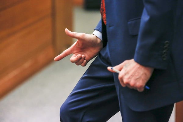 On Friday, April 13, 2018, defense attorney Bruce Harvey demonstrates with his hand how the gun used in the fatal shooting of Diane McIver may have been held. This was Day 19 of the Tex McIver murder trial in Fulton County Superior Court, and the defense rested its case. (ALYSSA POINTER/ALYSSA.POINTER@AJC.COM)