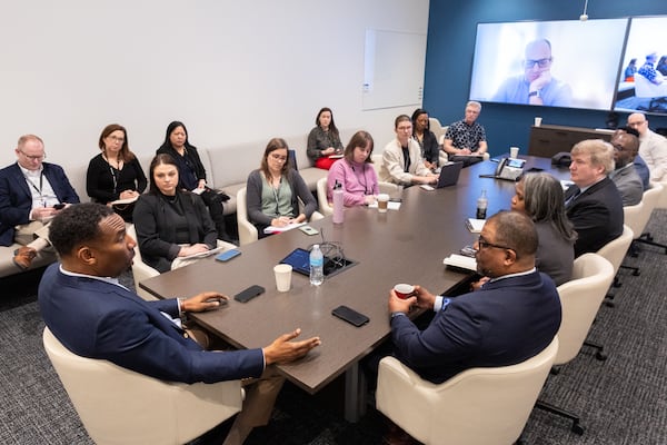 Mayor Andrew Dickens (left) speaks with reporters and editors during an editorial board meeting at the Atlanta Journal-Constitution office in Atlanta on Monday. Arvin Temkar/AJC