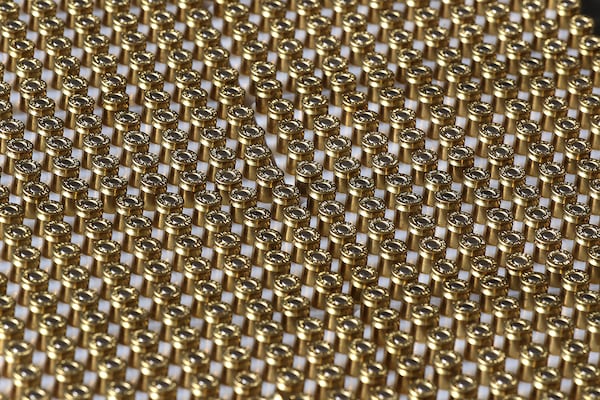 Dozens of handgun bullets are ready to load during a training session practicing a new technique to shoot and not kill. (Curtis Compton / Curtis.Compton@ajc.com)