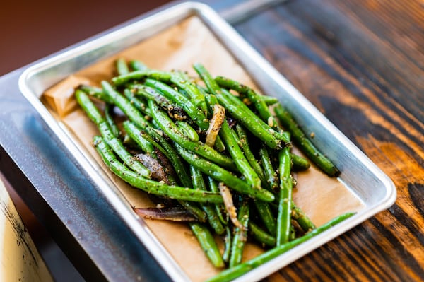 Sweet Auburn’s Wok-Fired Green Beans, which are on the menu at the Poncey-Highland location, are a side dish with an Asian touch. CONTRIBUTED BY HENRI HOLLIS