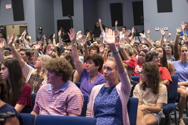 Members of the audience participate during a March For Our Lives rally at Eagles Nest Church in Roswell, Monday, July 30, 2018. (ALYSSA POINTER/ALYSSA.POINTER@AJC.COM)