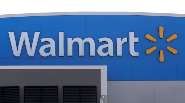 FILE - A Walmart logo is displayed outside of a Walmart store, in Walpole, Mass., Sept. 3, 2019. (AP Photo/Steven Senne, File)