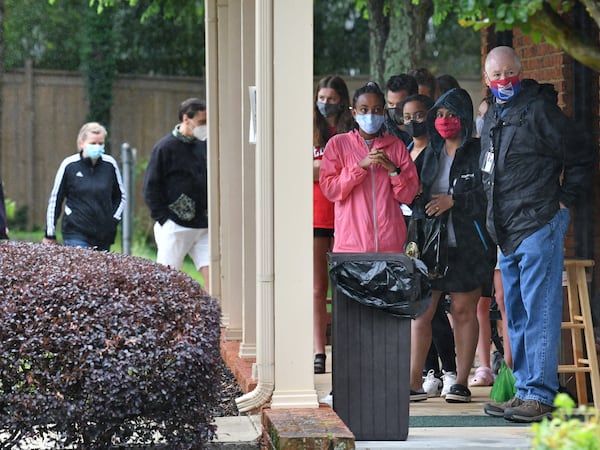 May 12, 2021 Decatur - A line of adolescents and their parents stood in the drizzling rain outside Dekalb Pediatric Center awaiting their first dose of COVID-19 vaccine in Decatur on Wednesday, May 12, 2021. More than a thousand patients, most of them 12-15 years old, had seized the opportunity to get a shot of the Pfizer-BioNTech vaccine at the clinic, which is partnering with the local school system to vaccinate students. (Hyosub Shin / Hyosub.Shin@ajc.com)