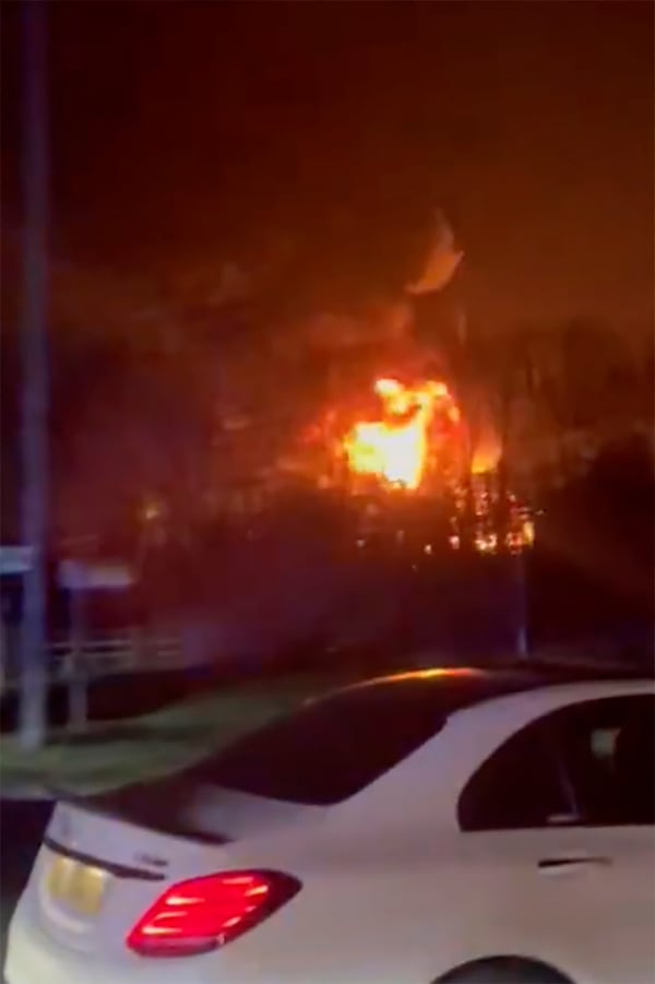 In this photo taken from video provided by Matthew Muirhead, a fire is seen at the North Hyde electrical substation near the Heathrow Airport in London, early Friday, March 21, 2025. (Matthew Muirhead via AP)