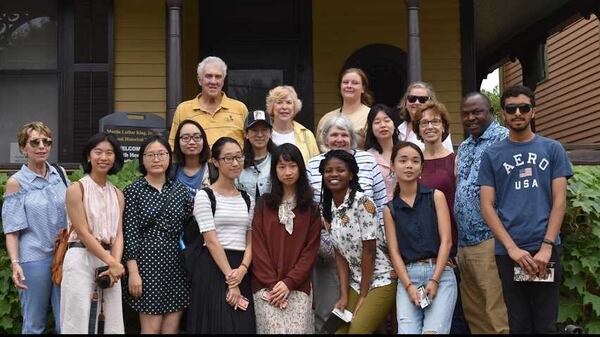 International students involved in the Atlanta Ministry with International Students pose outside the childhood home of the Rev. Martin Luther King Jr. The organization helps ease the transition of international college students to the Atlanta area. CONTRIBUTED