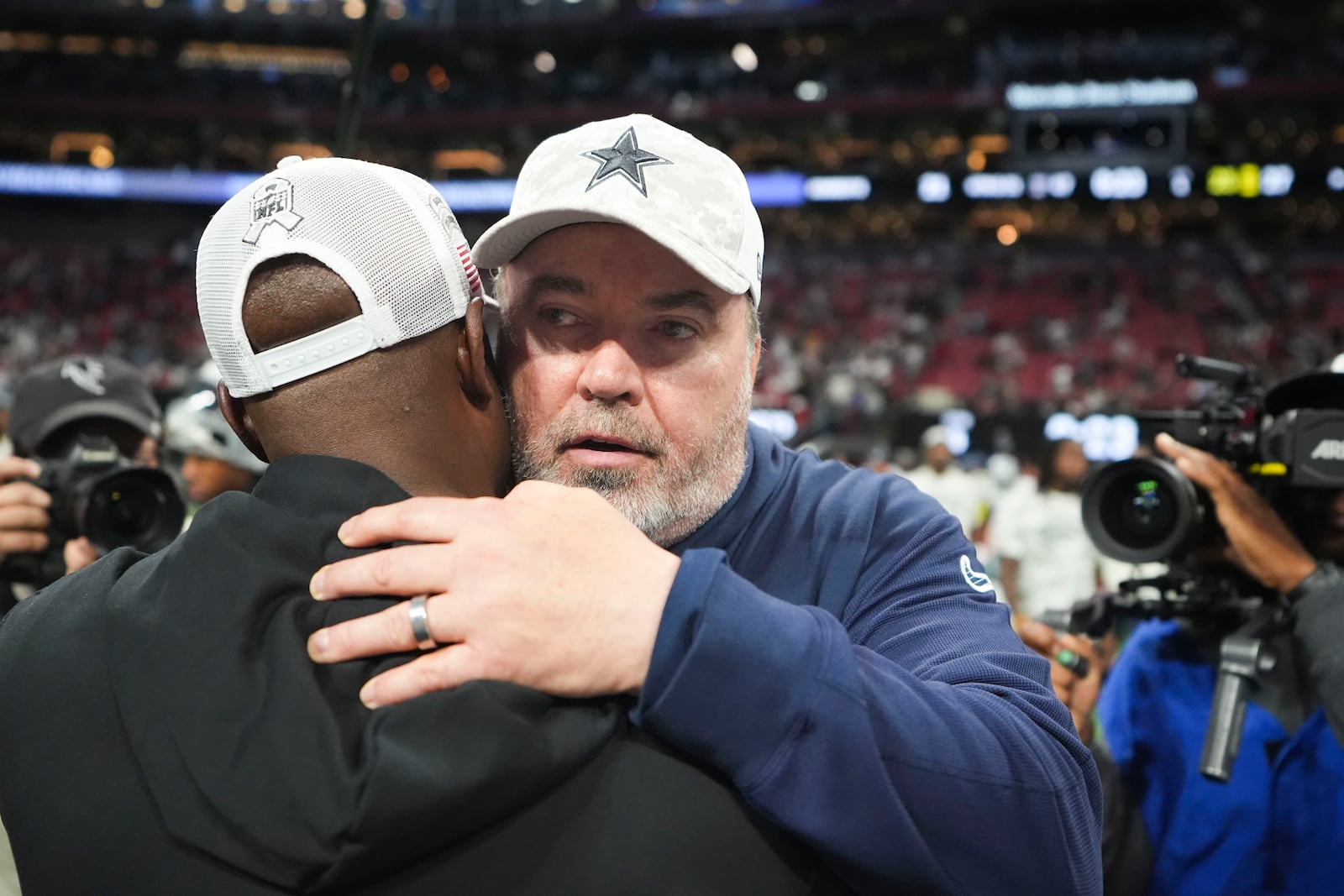 Dallas Cowboys head coach Mike McCarthy, facing, greets Atlanta Falcons head coach Raheem Morris after an NFL football game, Sunday, Nov. 3, 2024, in Atlanta. The Falcons won 27-21. (AP Photo/ Brynn Anderson)