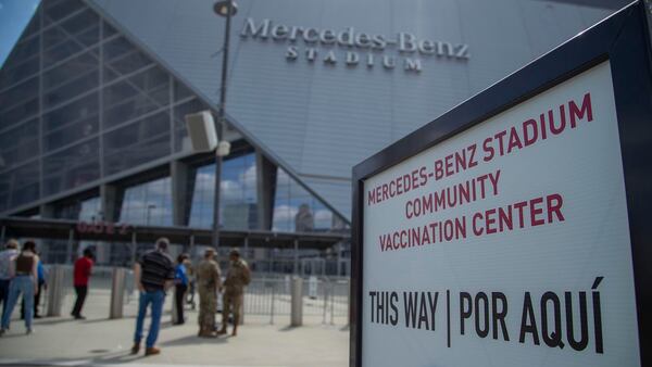 People flocked to mass vaccination sites, like this one at Mercedes Benz stadium, which accepts walk-ups. (Alyssa Pointer / Alyssa.Pointer@ajc.com)