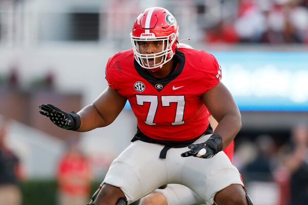 Georgia Bulldogs offensive lineman Devin Willock (77) blocks on a passing play during their NCAA football game against the Vanderbilt Commodores at Sanford Stadium, Saturday, October 15, 2022, in Athens, Ga. (Jason Getz / Jason.Getz@ajc.com)