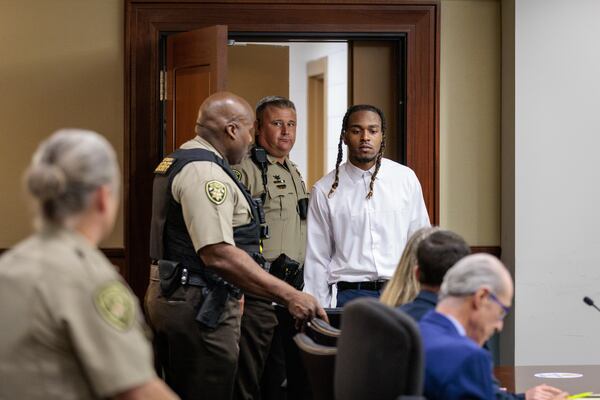 Bryan Rhoden enters a Cobb County courtroom Wednesday afternoon. He faces the death penalty.